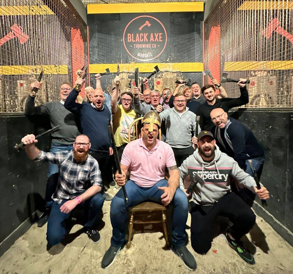 The motley Crew picture of the lodge members posing for a group photo with their axes in hand