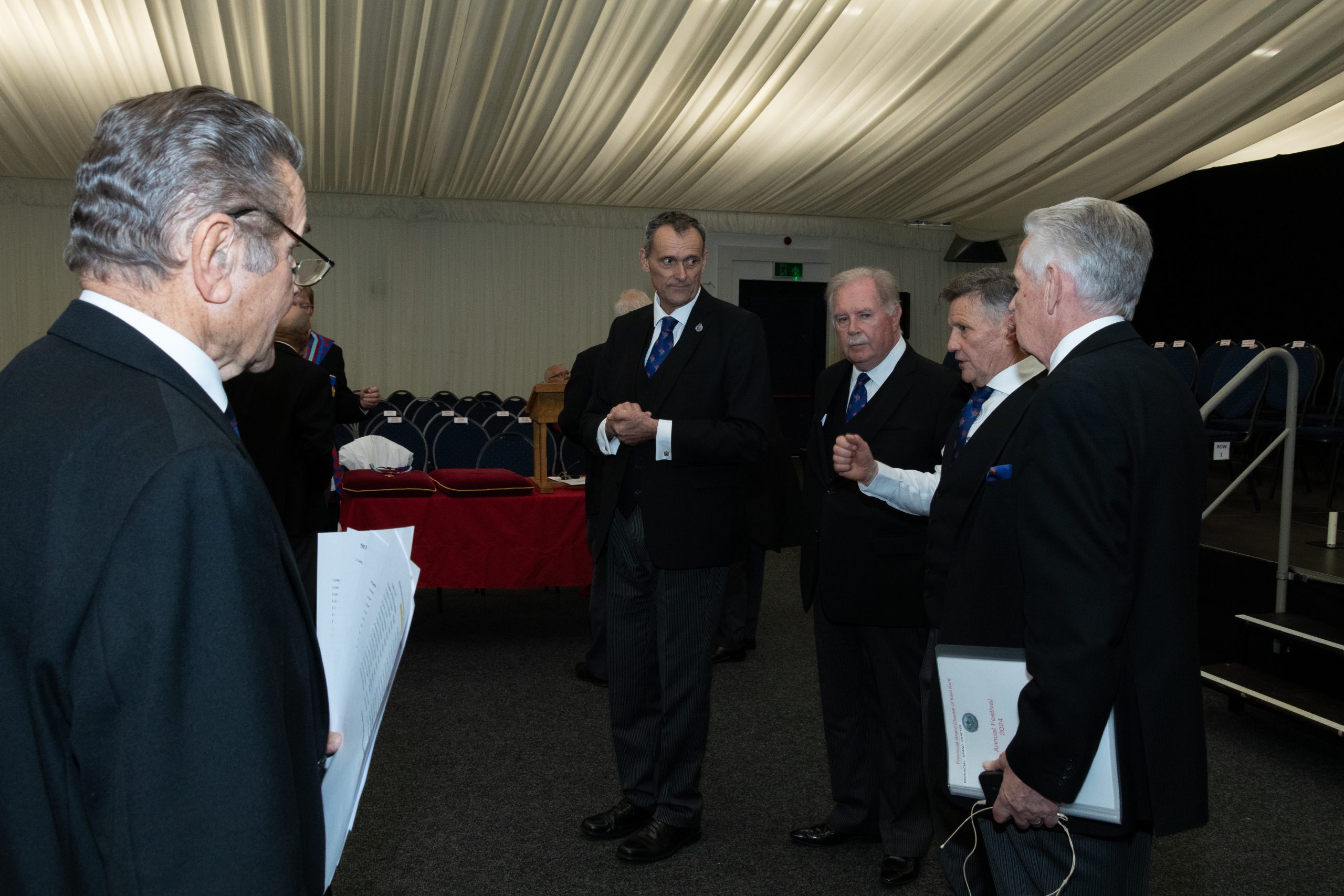 Provincial director of ceremonies briefs the principles