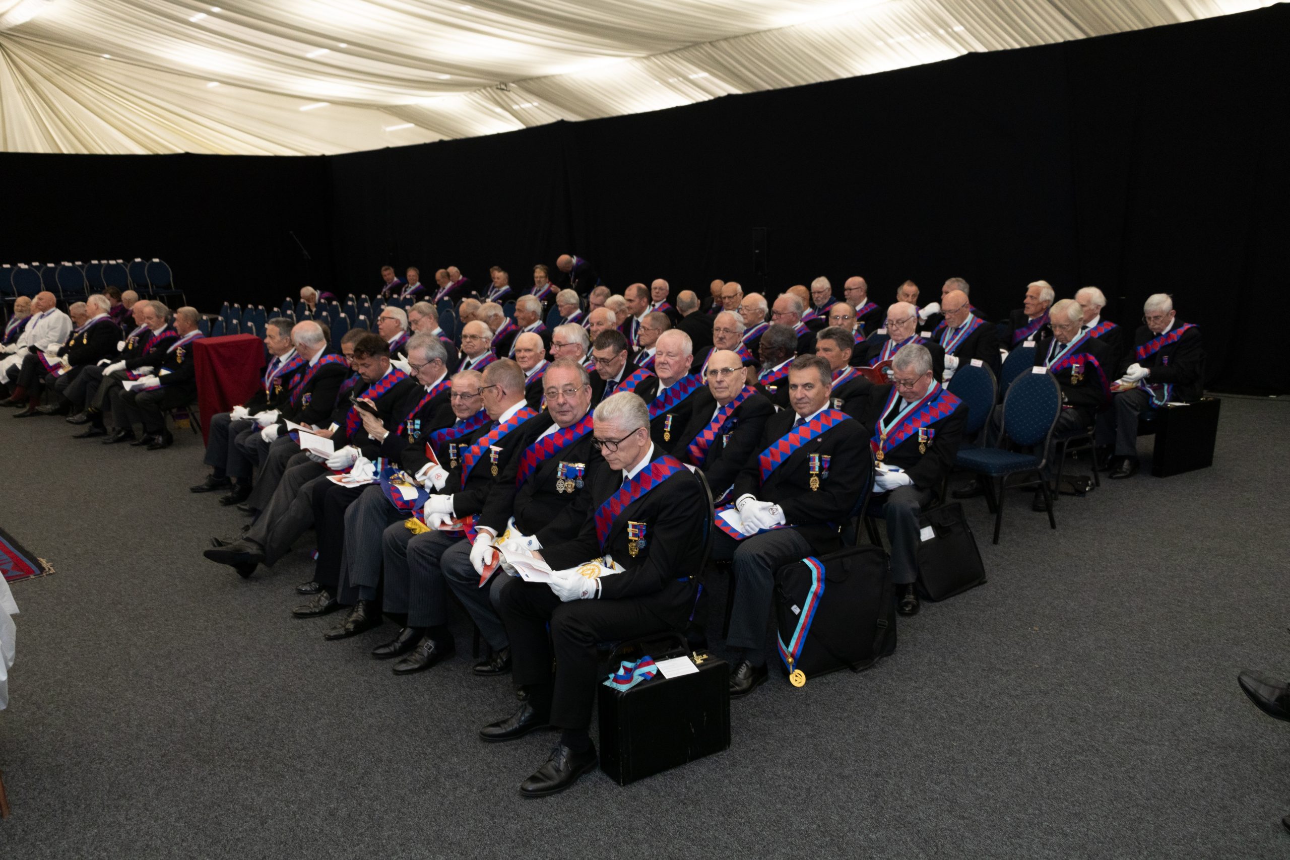 Companions seated ready for the meeting to start