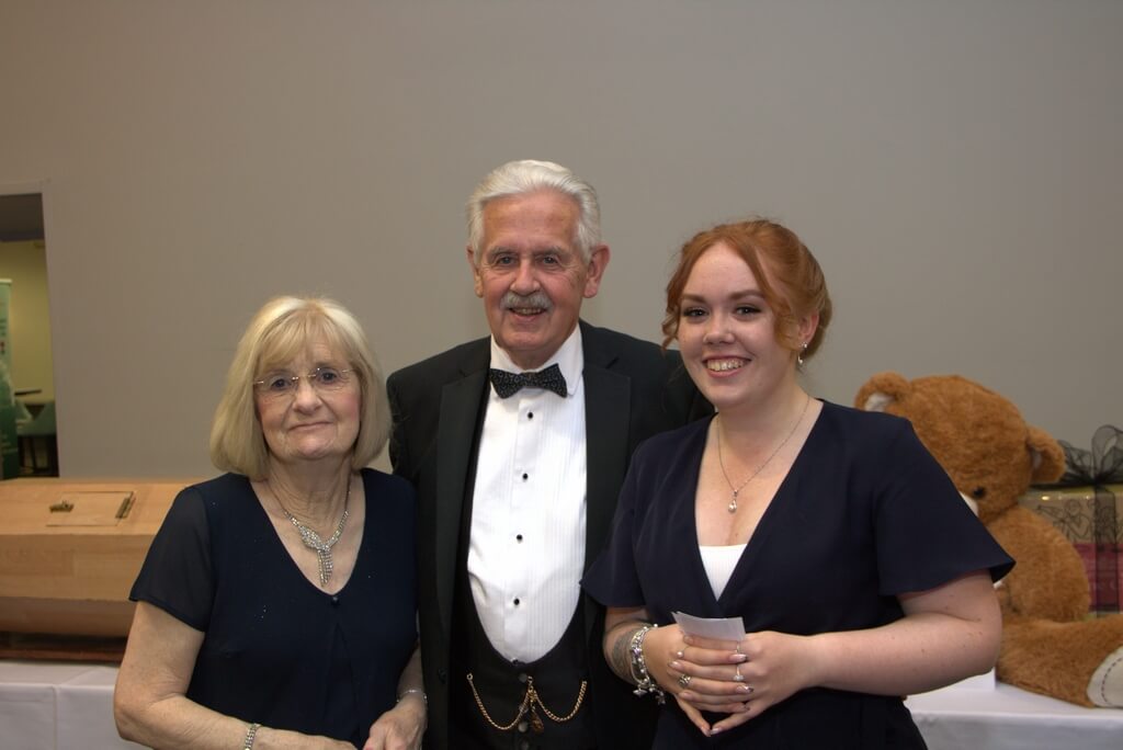 WBro Mark Bassant receiving the Grand Draw Prize from Margaret Johnstone and the the PGM, Neil Johnstone